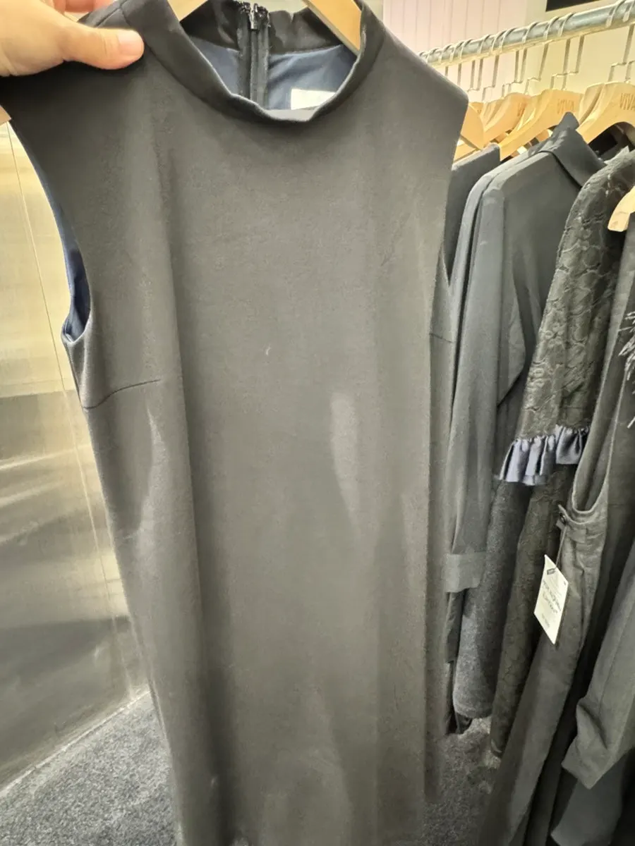 Higher-priced women's clothing line at the back of the store