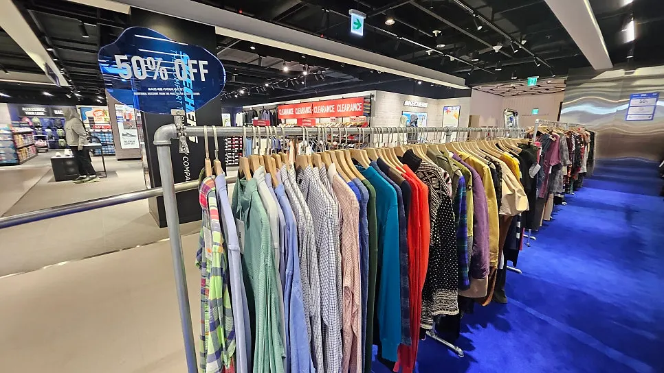 Clothing hung on racks in the luxury vintage section