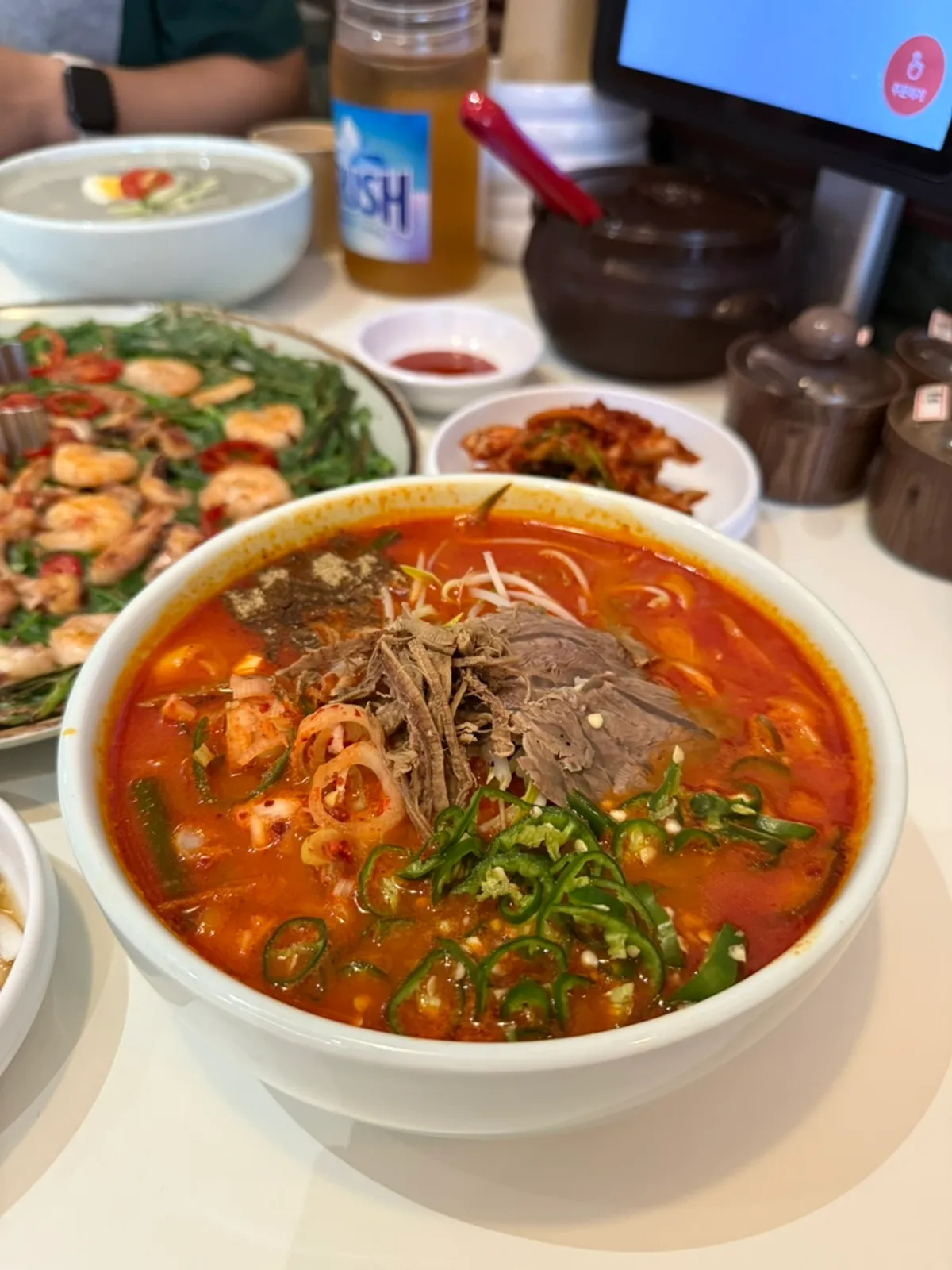 Extra spicy yukgaejang kalguksu topped with cheongyang chili peppers