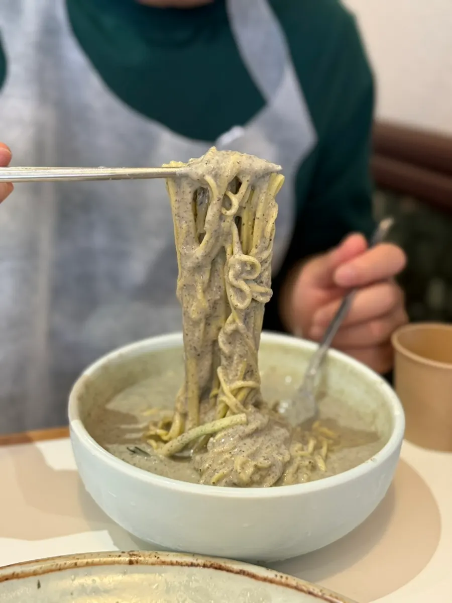 Rich black bean broth and noodles