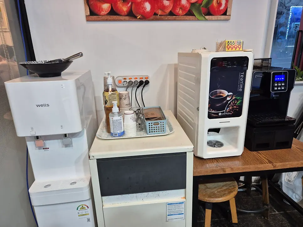 Self-service bar with water cooler, ice maker and coffee machine