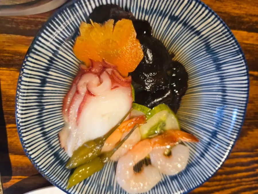 A plate of neatly arranged side dishes