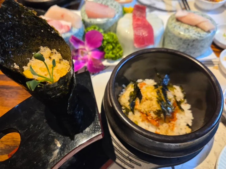 Final spread of egg roe rice loaded with flying fish roe and maki