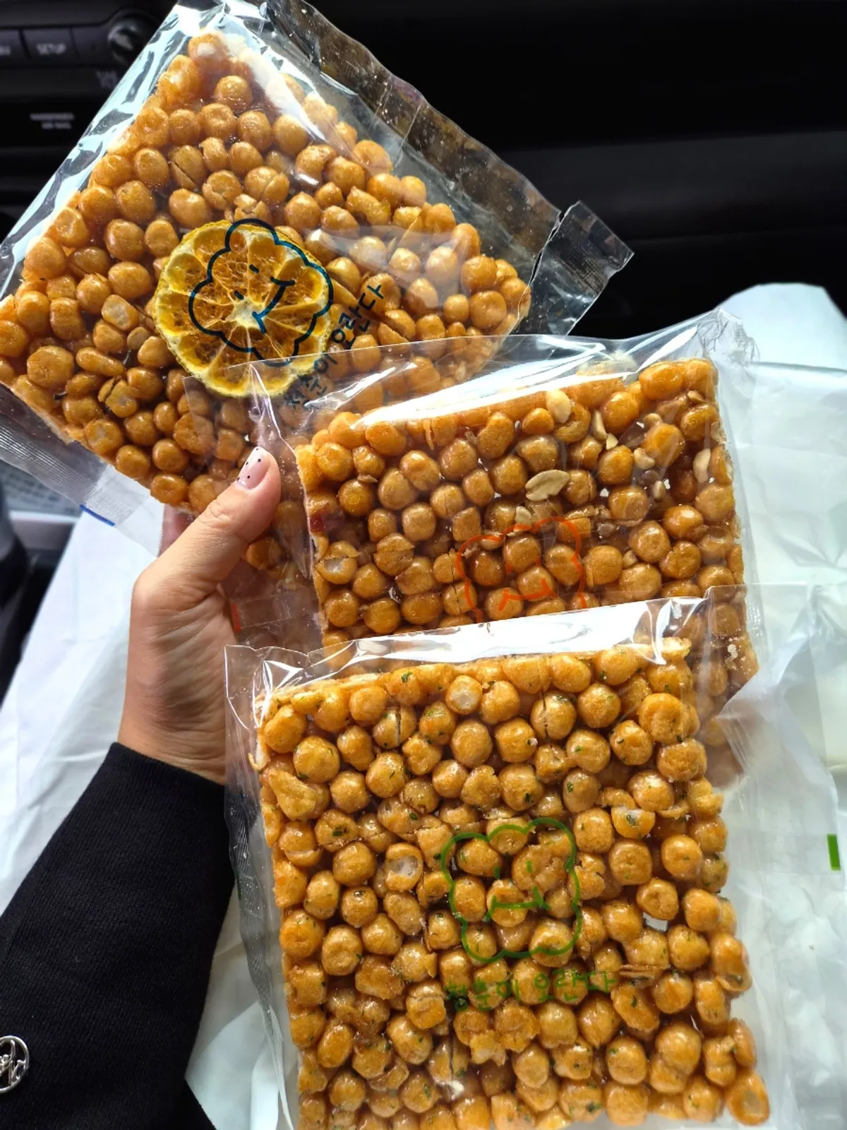 Three bags of square oranda picked as a car snack