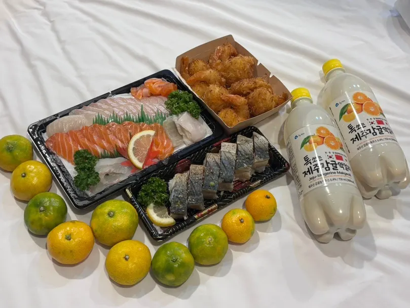 Flatfish and salmon sashimi with mackerel sushi laid out at the accommodation