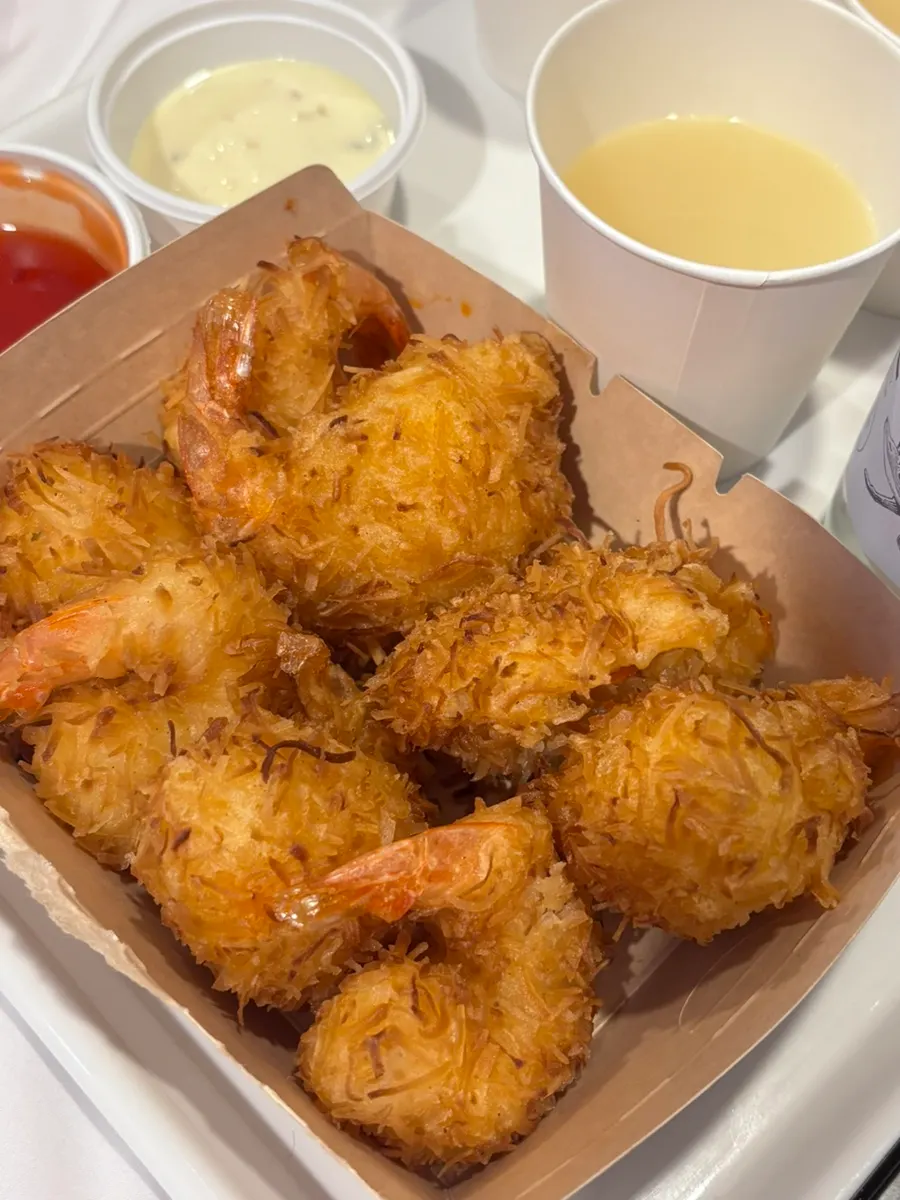 Coconut fried shrimp served alongside sashimi