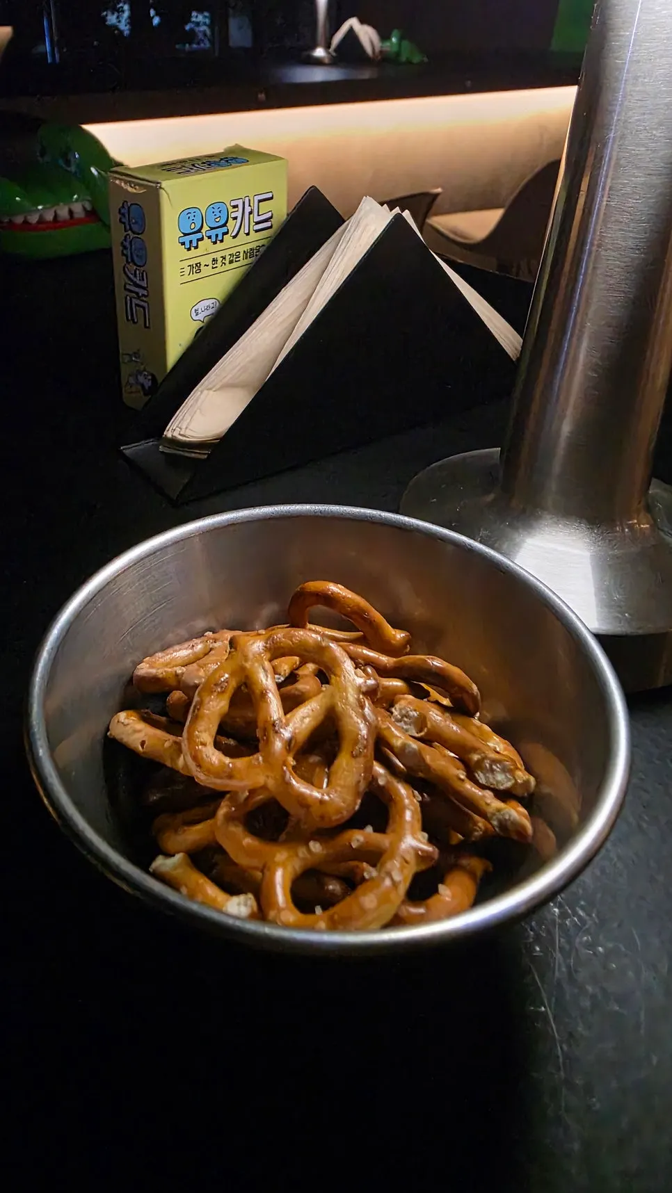 Pretzels and Yuyu cards on a table