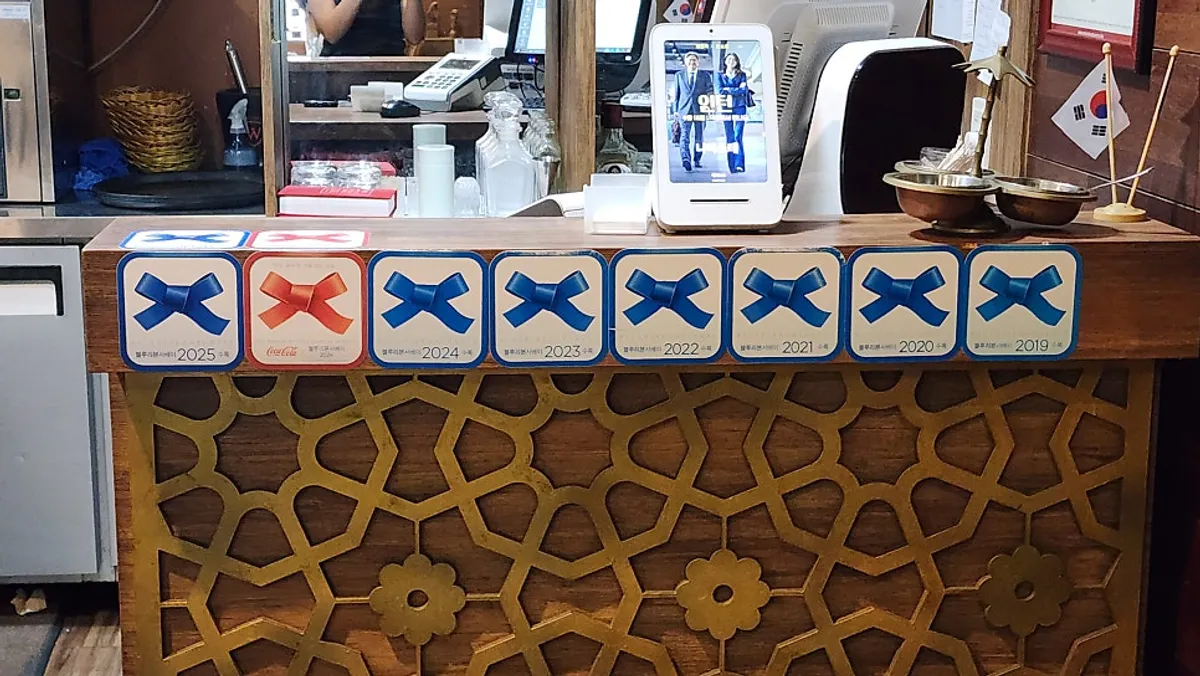Blue Ribbon signage displayed inside Namaste Dongmyo Branch