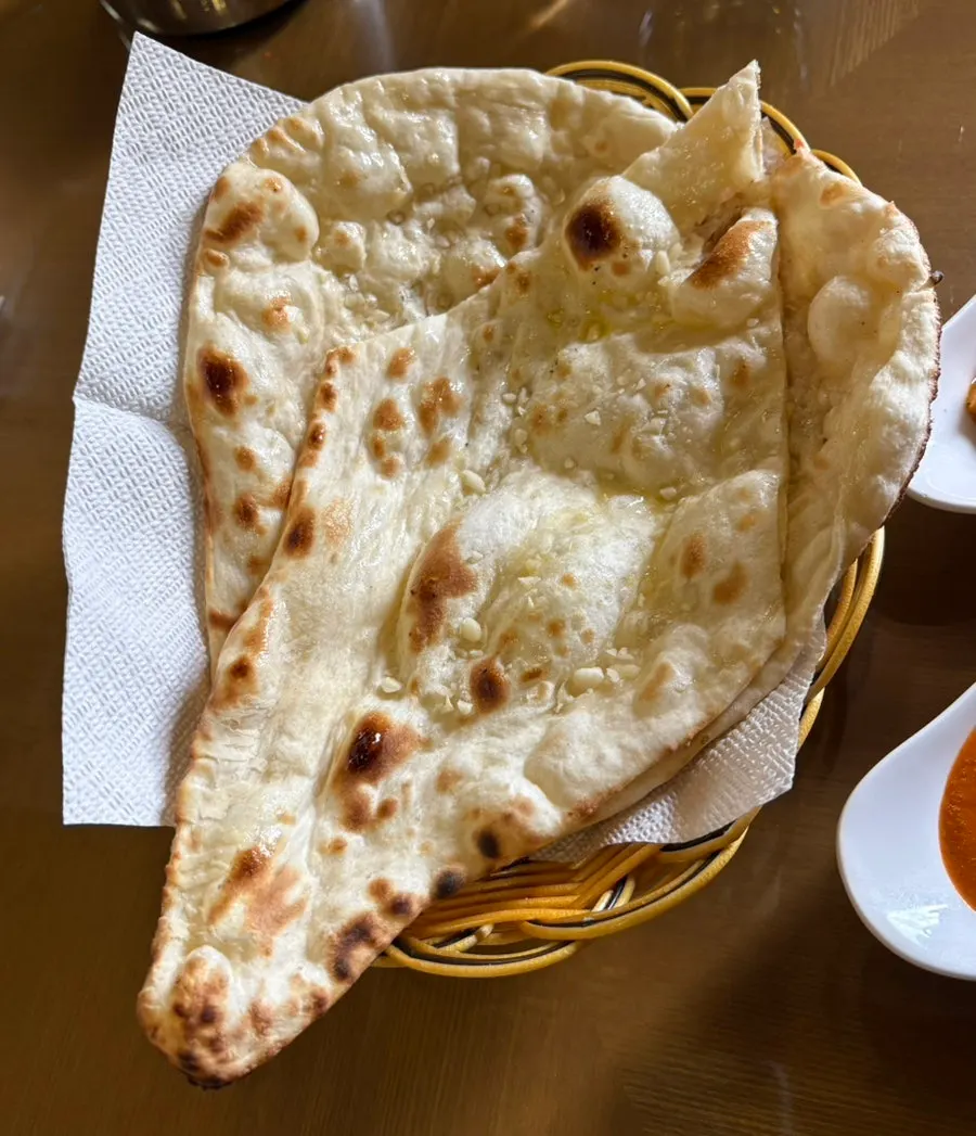 Full view of the curry and sides in the set for two