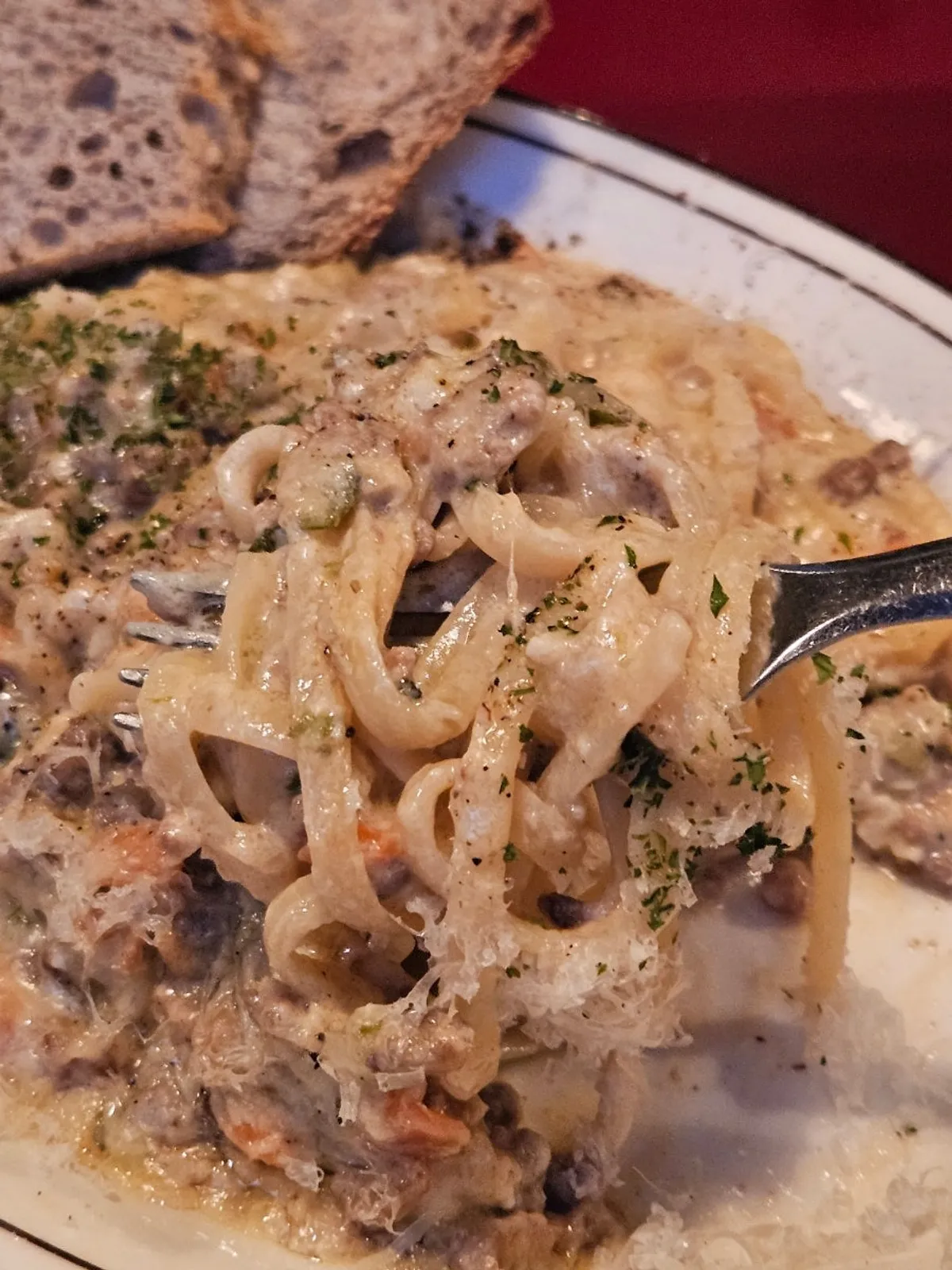 Cream ragu pasta noodles with sauce clinging to them