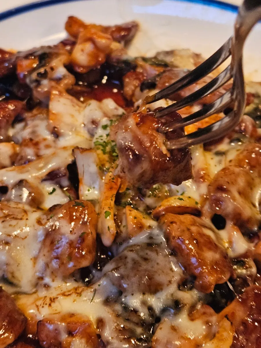 A piece of pork chop with sauce