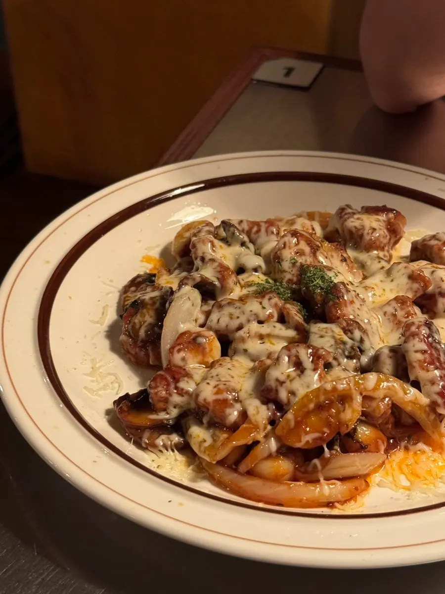 Ragu tteokbokki topped with beef brisket