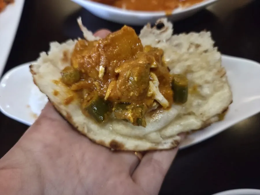 Vegetable curry piled onto naan