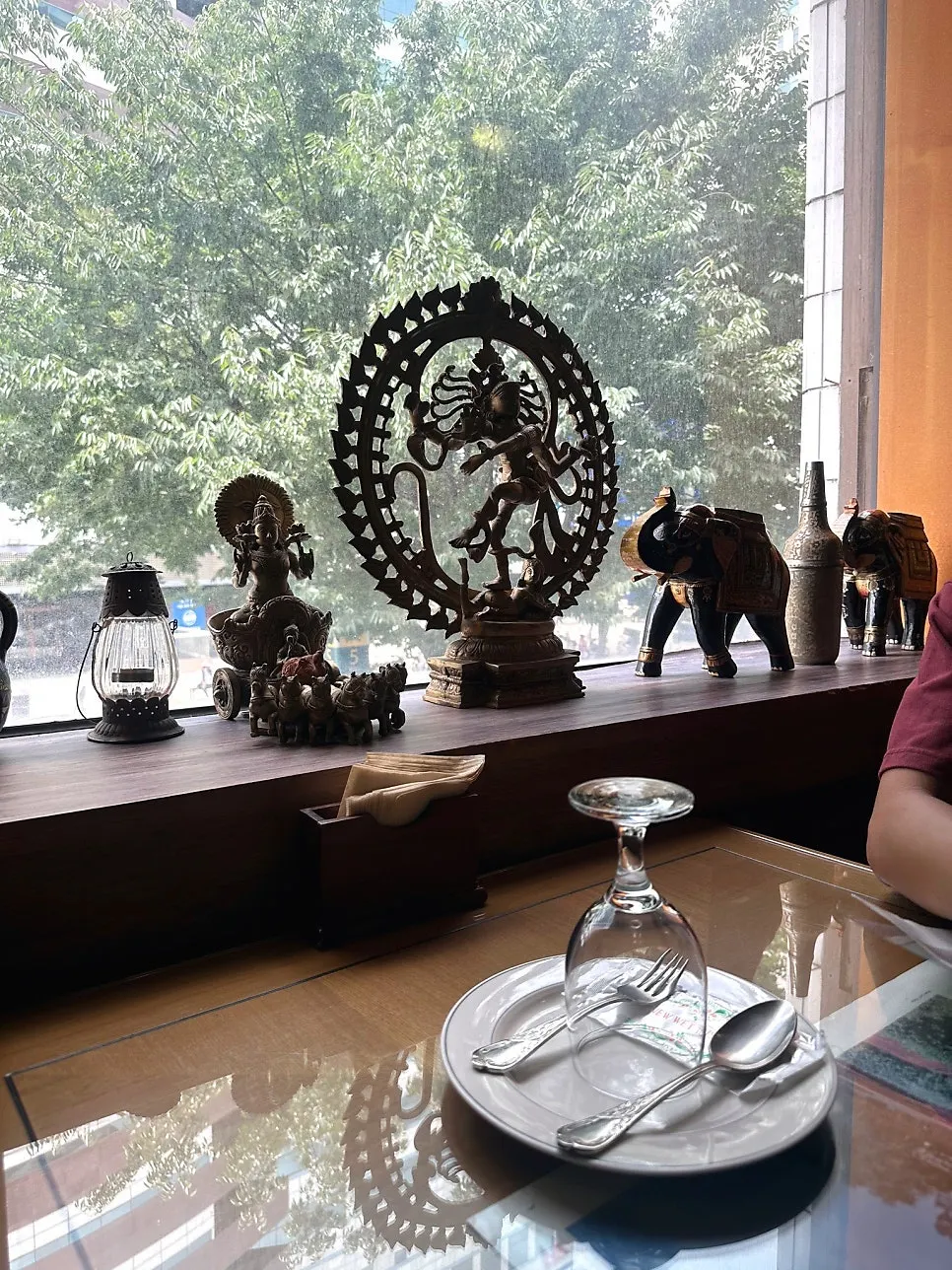 A corner of the restaurant decorated with Indian-style decor pieces