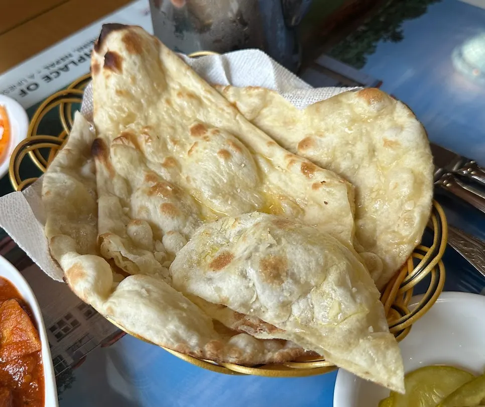 Close-up of a palm-sized piece of tandoori chicken