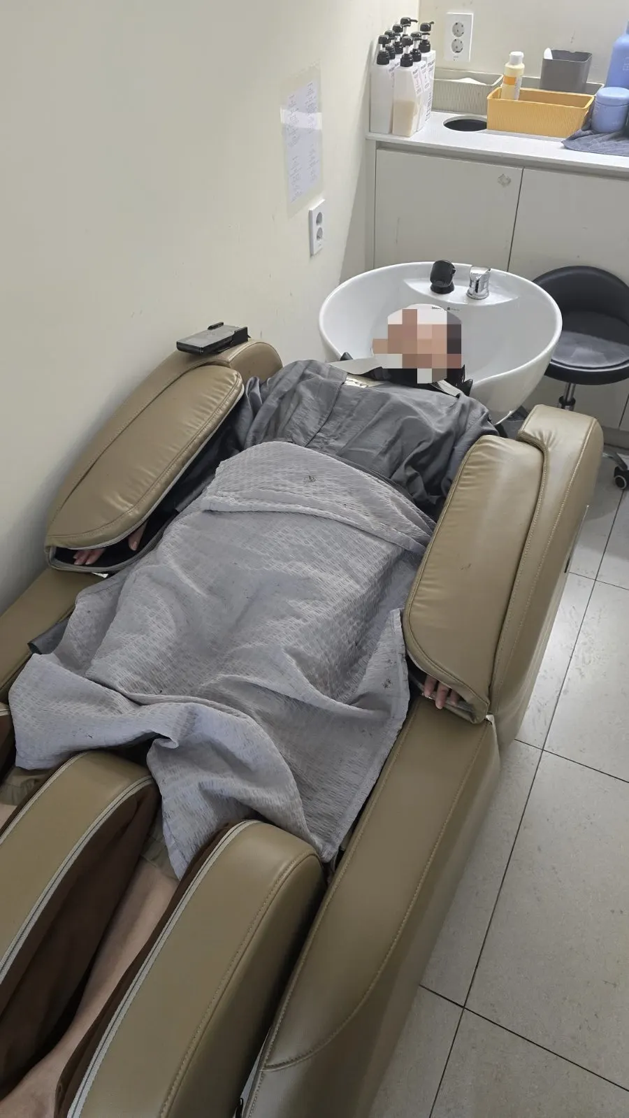 Reclining massage chair in Chamer's shampoo and spa area
