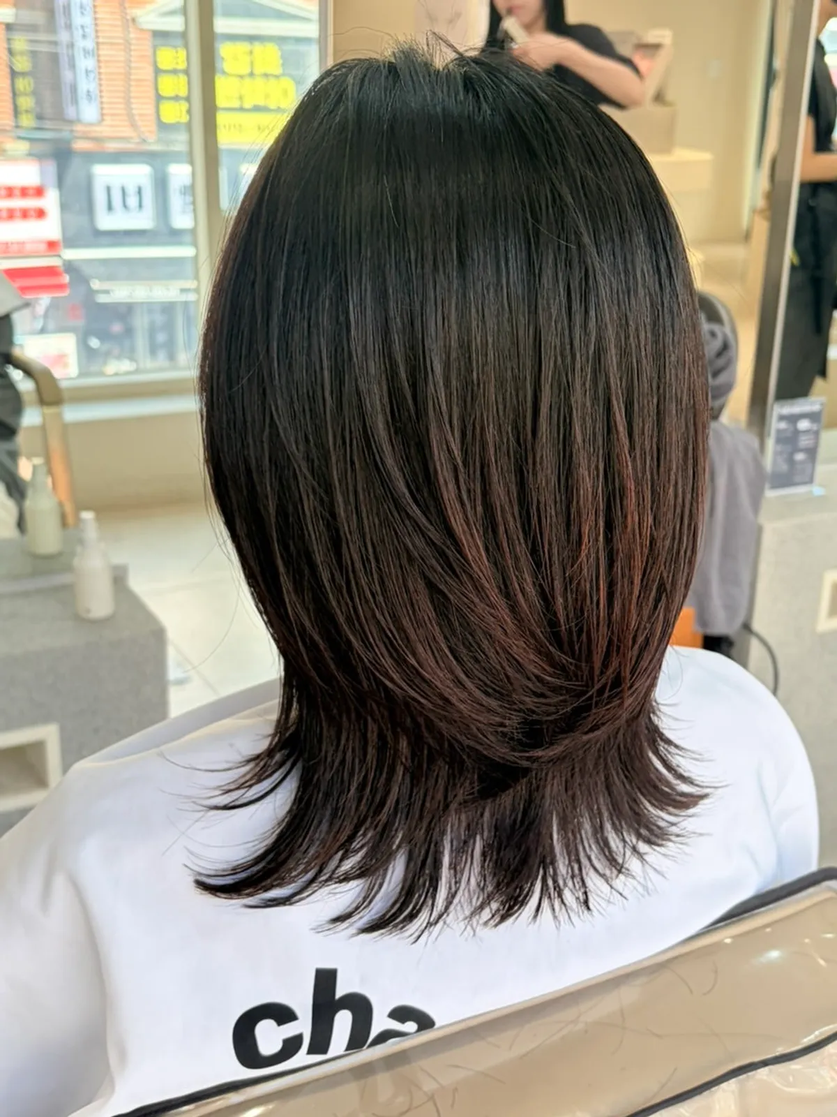 Finished mid-length hair with hush cut and volume magic straightening