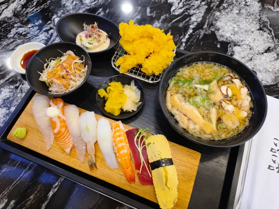 The full single-serving sushi set spread across the table