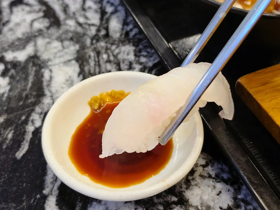 Plate of sushi including flounder sushi