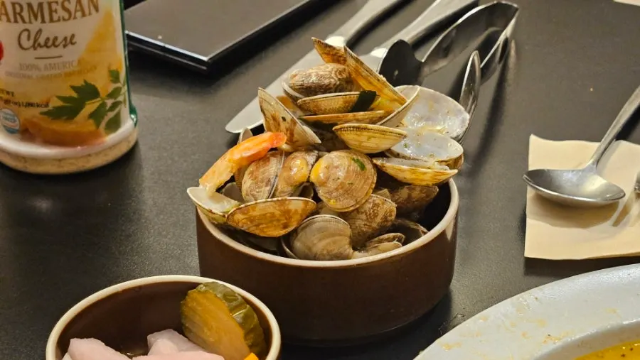 Close-up of clams and shrimp on the oil pasta