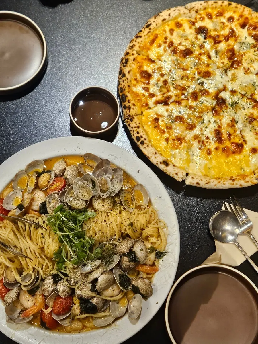 Vertical shot of the clam shrimp oil pasta