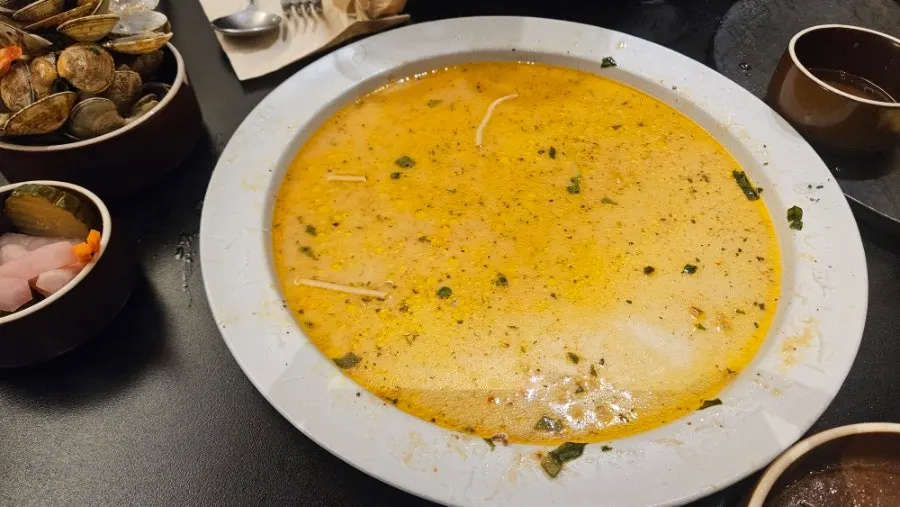 Table set with both pizza and pasta