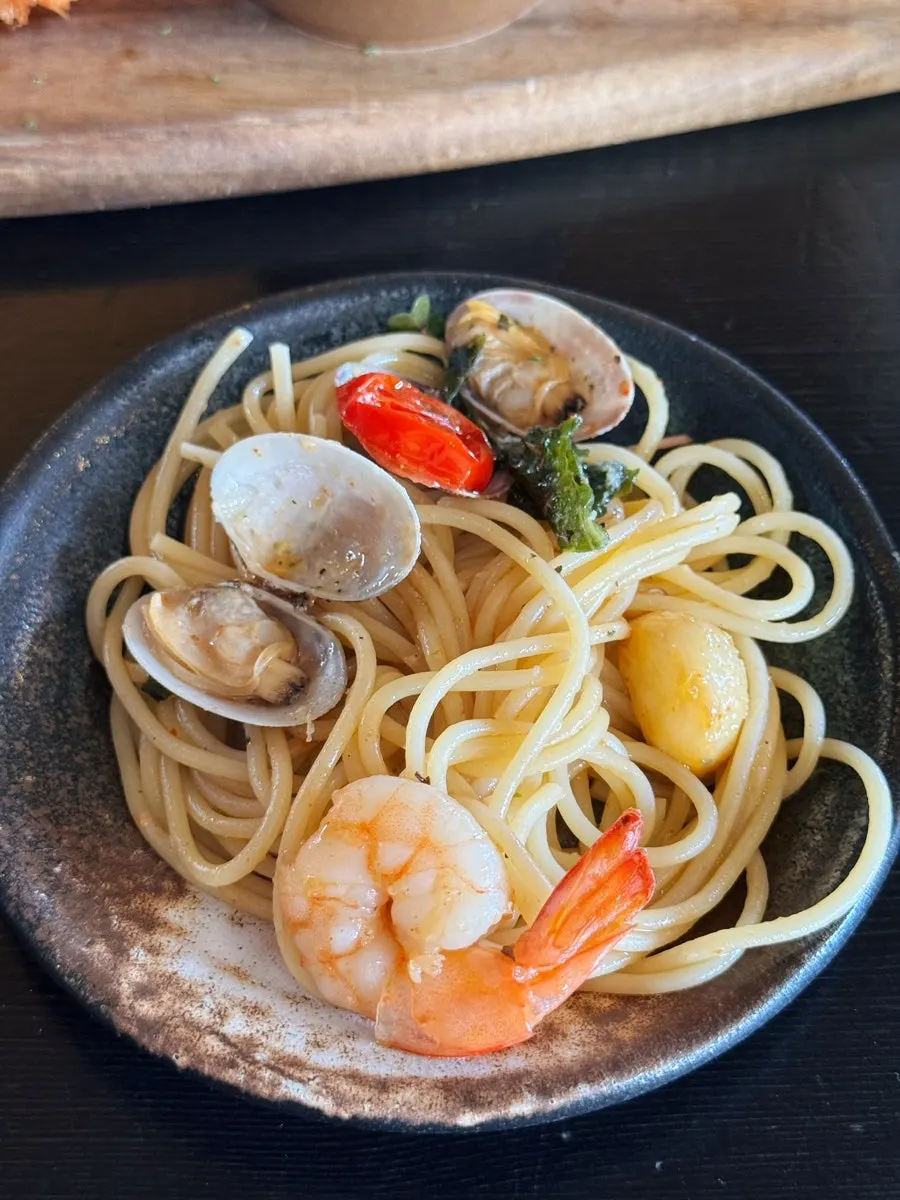 Lifting up a forkful of springy pasta noodles