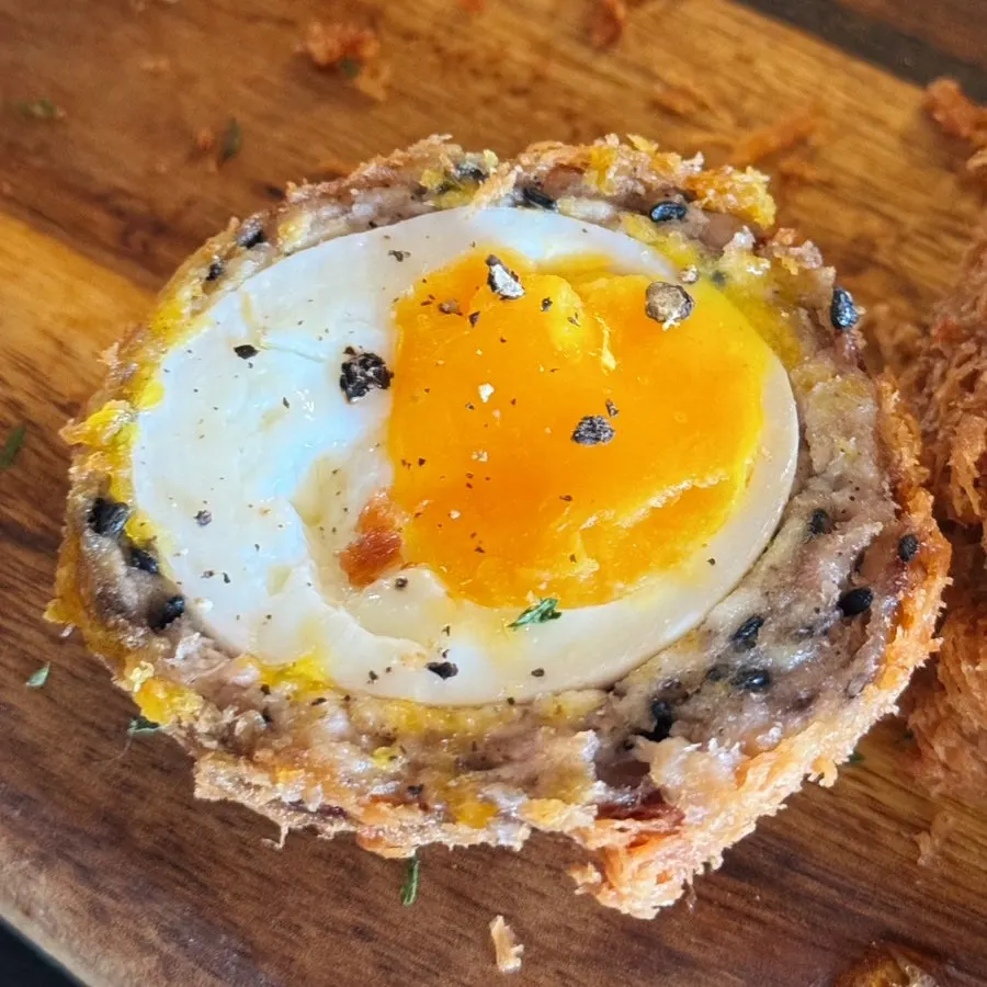 Cross-section of Scotch katsu with soft-boiled egg