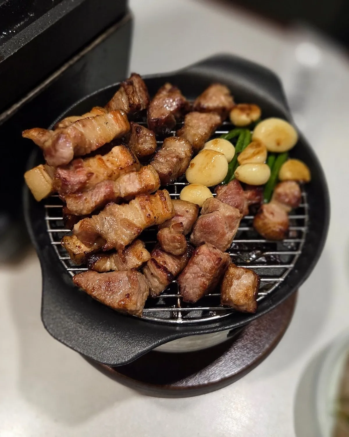 Thick nuruk pork neck grilling on the pan
