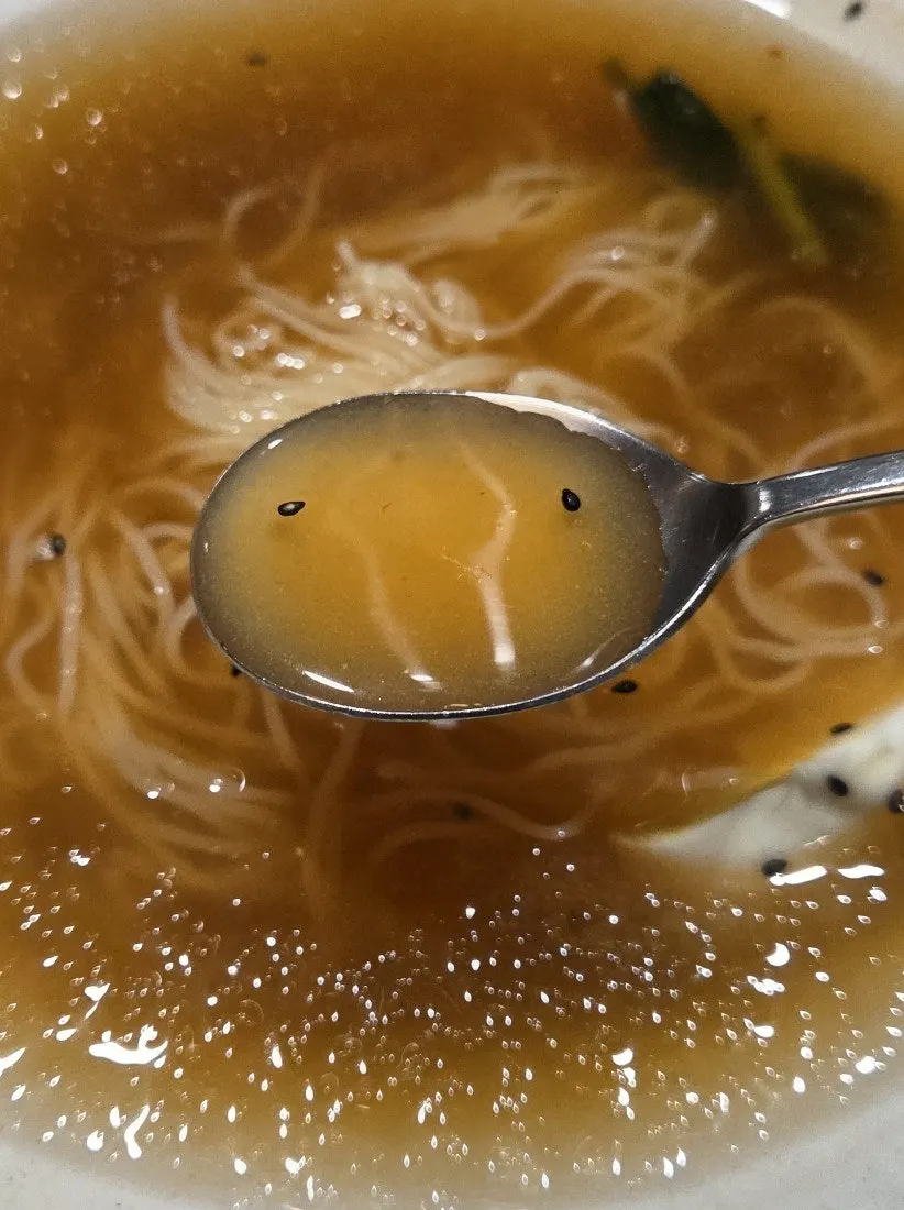 Mil-myeon noodles lifted with chopsticks