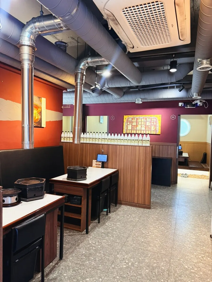 Interior of Sanseong Meat Shop blending wood and tiled roof elements