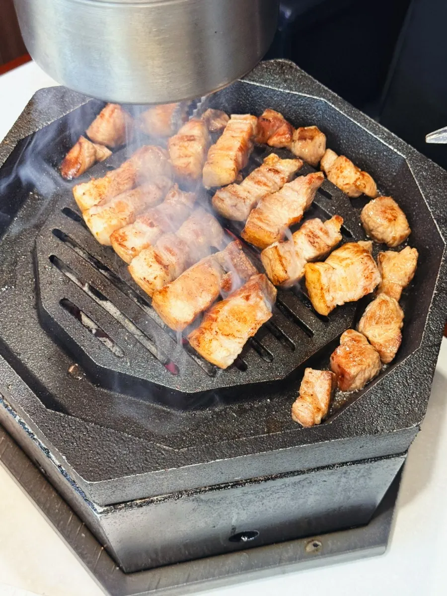 Pork cooking on the grill