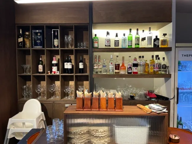 Interior seating area at Sasaenghwal with self-serve water and tableware