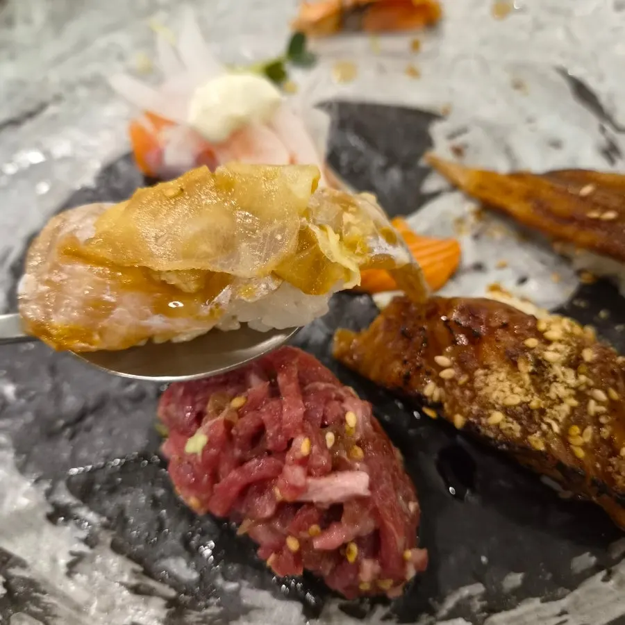 Sushi topped with generously sized fish