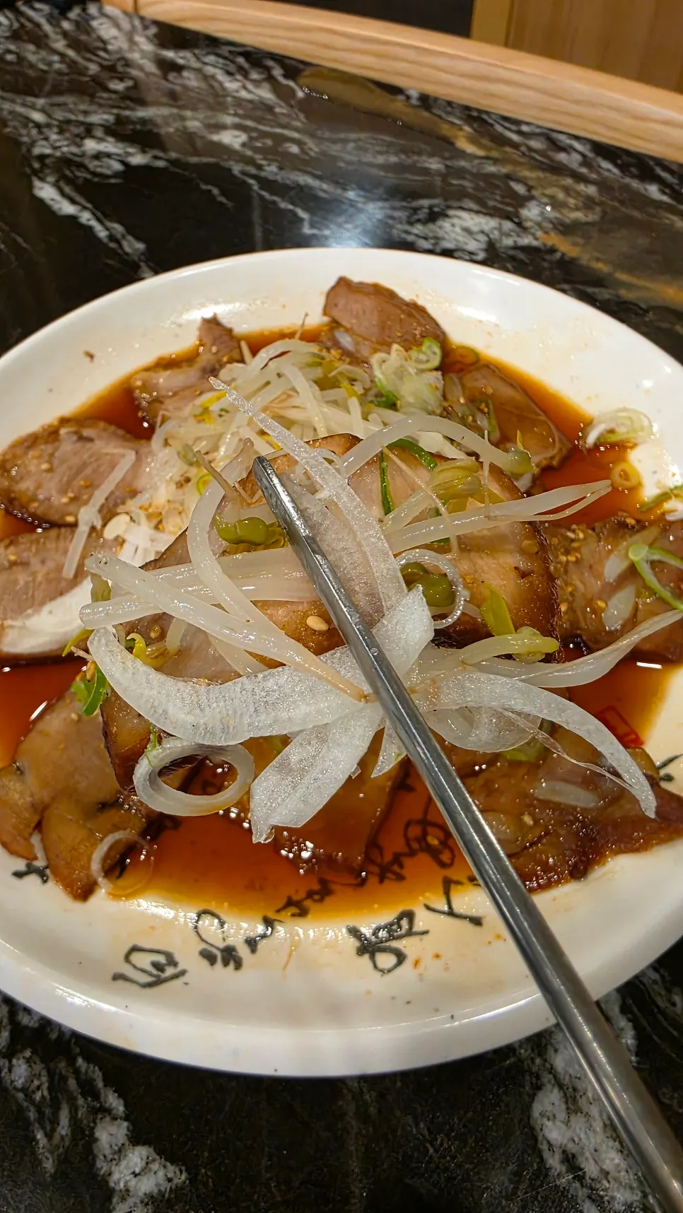 Chashu enjoyed alongside sushi