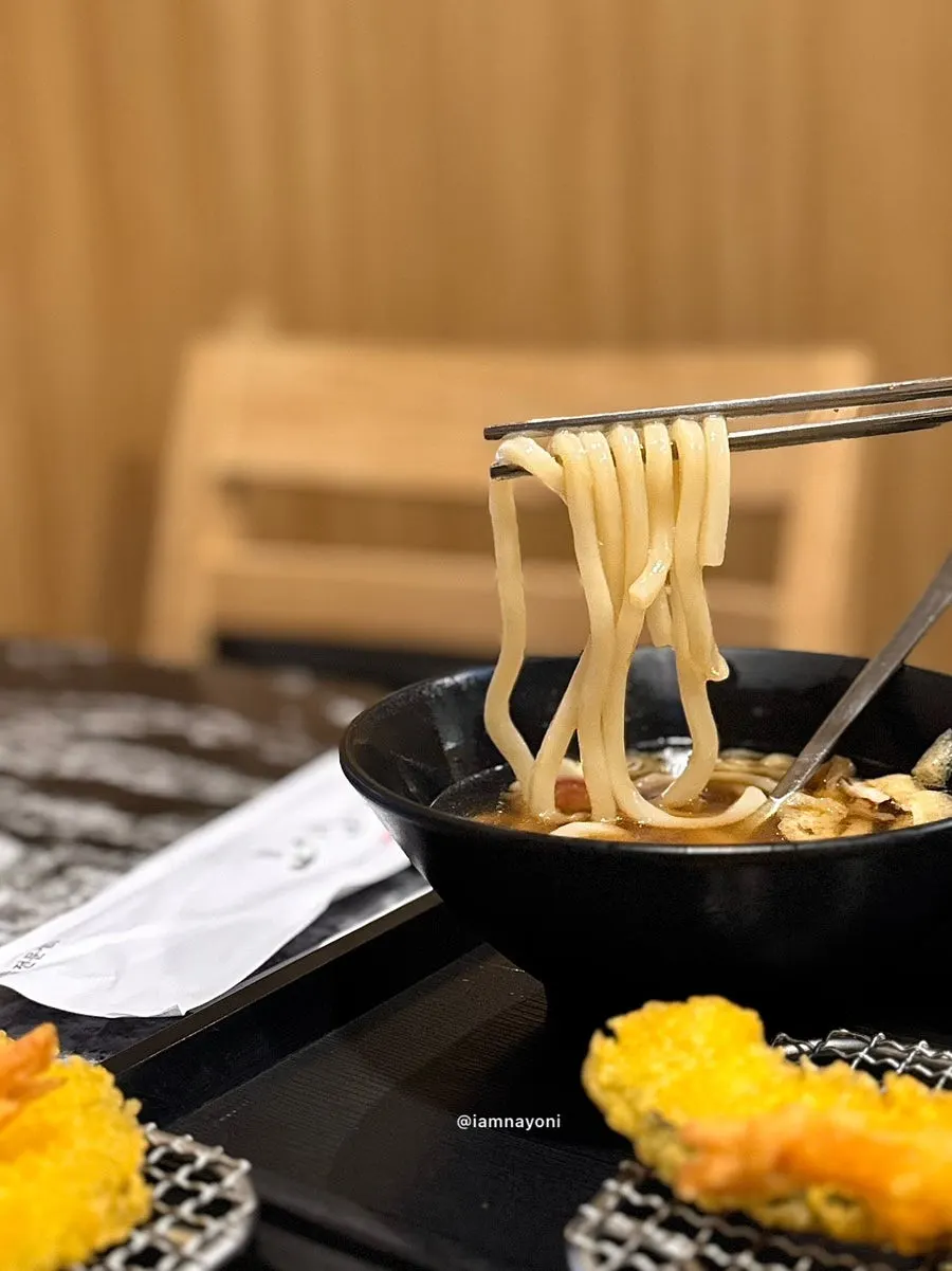 Sushi with a full-sized bowl of udon