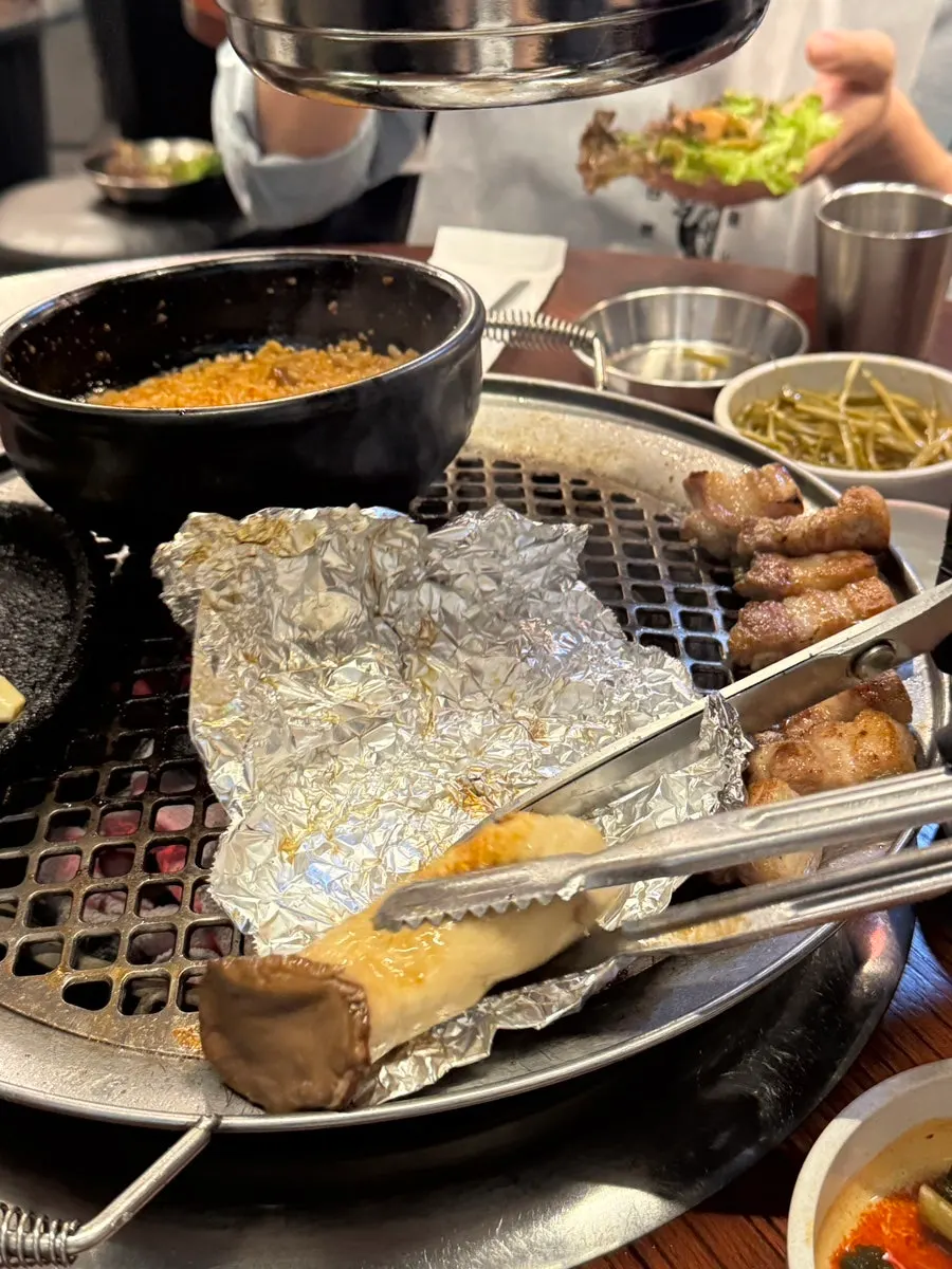 Grilled mushroom cut open from inside the foil