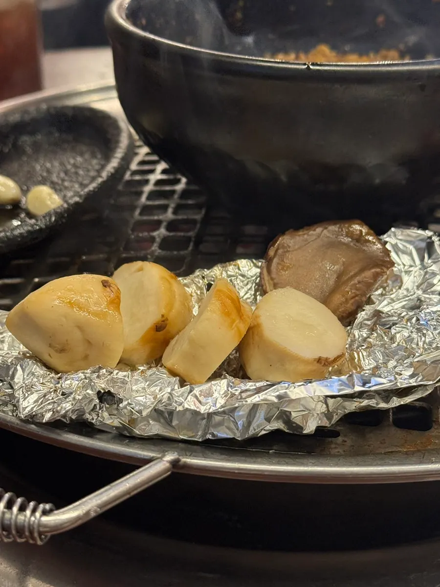 Moist grilled mushroom served alongside the meat