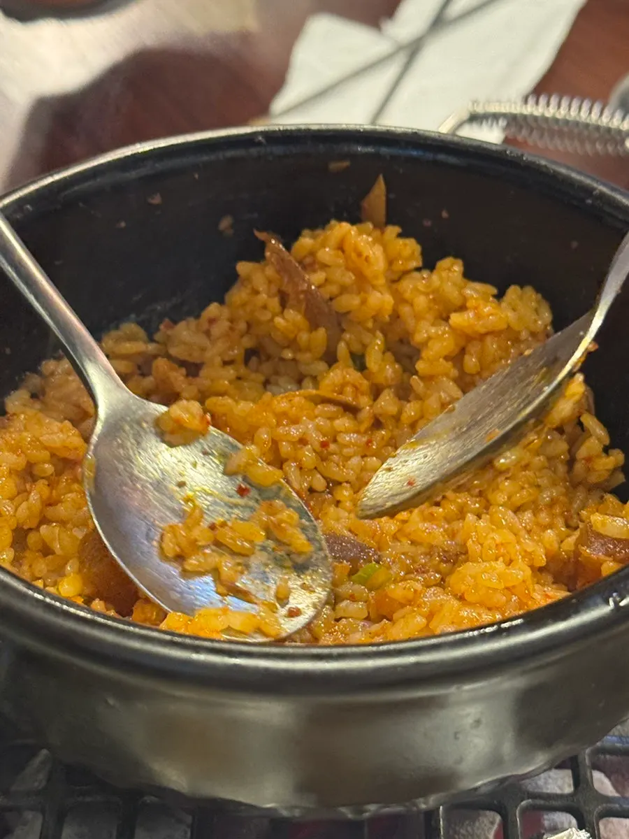 A piece of leftover meat next to the fried rice