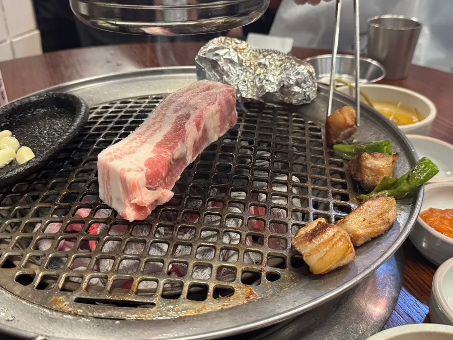 Thick pork belly grilling on the pan