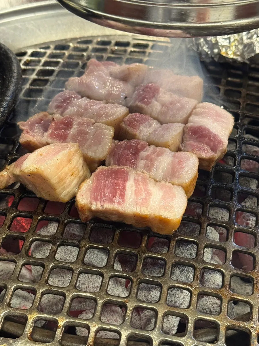 Close-up of pork belly turning golden brown