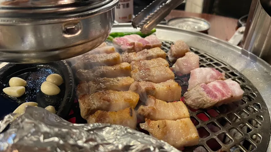 Side dishes and sauces spread at Dongnaejeong Main Branch