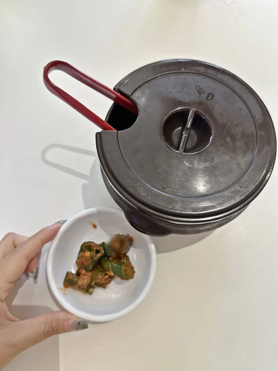 Cucumber-pepper doenjang salad and a jar of kimchi as basic side dishes