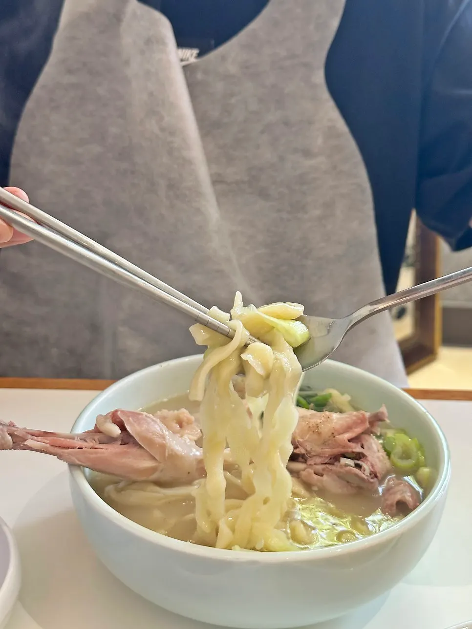 Rich samgye broth and chicken meat