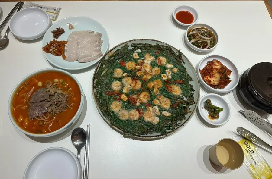 Table set with kalguksu, chive pancake and suyuk