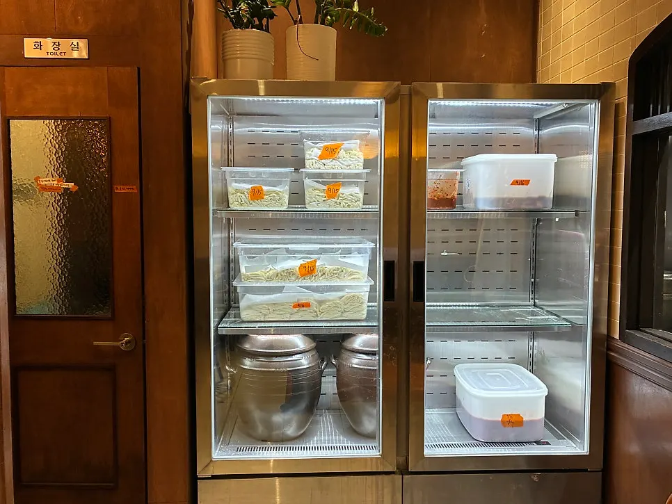 Fresh noodles stored in the fridge with date labels attached