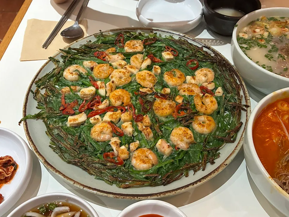 Piece of seafood chive pancake cut with scissors