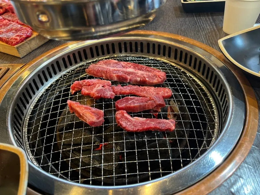 Special cuts of hanwoo grilling over charcoal