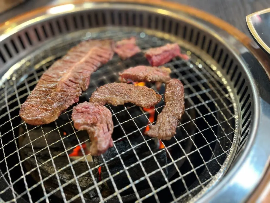 Beef cooking on the grill plate