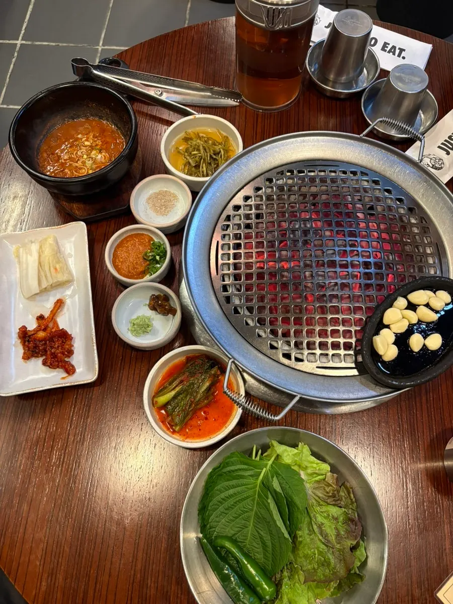 Basic side dishes including Sokcho fermented squid and mustard leaf kimchi